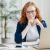 pleased-cheerful-female-economist-develops-financial-startup-project-poses-in-office-interior